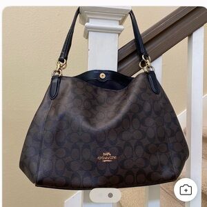 Hallie Shoulder Bag in Signature Canvas.